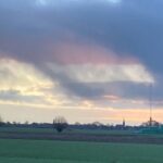 Aarti photographs the Dutch flag in the sky above IJsselstein