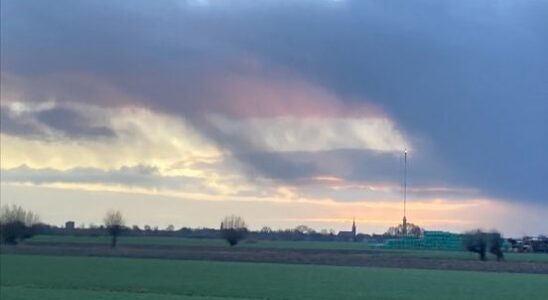 Aarti photographs the Dutch flag in the sky above IJsselstein