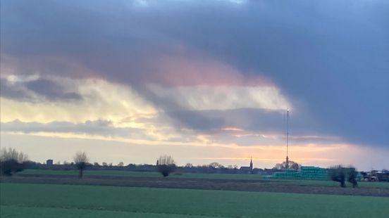 Aarti photographs the Dutch flag in the sky above IJsselstein