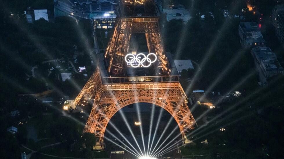 Aerial view of the Eiffel Tower and the illuminated Olympic rings during the opening ceremony of the Olympic Games in Paris, July 26, 2024.