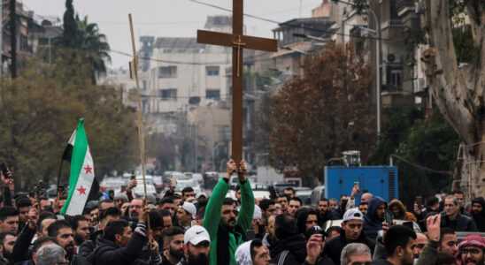 Christians in Damascus demonstrate after burning a Christmas tree to