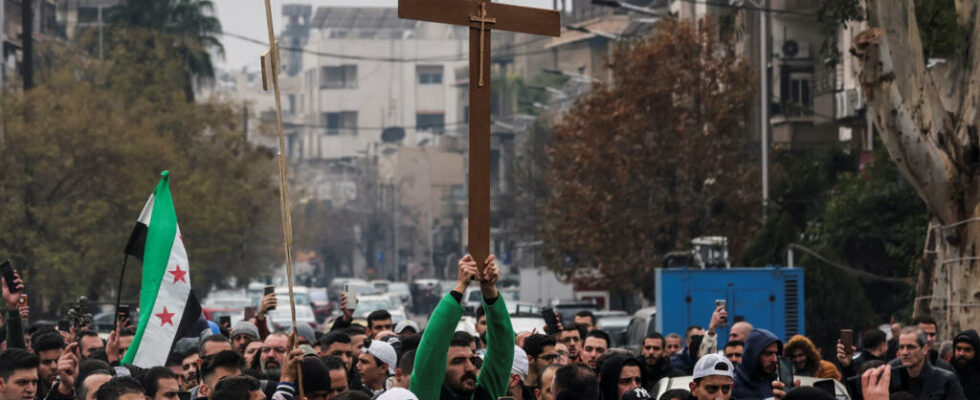 Christians in Damascus demonstrate after burning a Christmas tree to