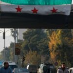 Kurds in Syria raise the flag of the opposition