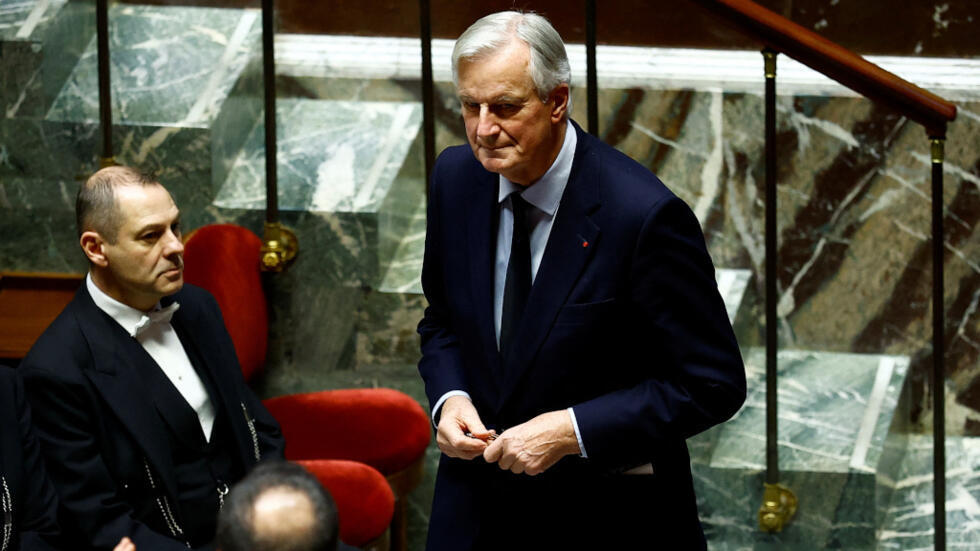 French Prime Minister Michel Barnier leaves after delivering his speech to announce the French government's use of Article 49.3, a special clause in the French Constitution, to pass the budget bill through the National Assembly without a vote legislators, during a debate on the social security financing bill (PLFSS) for 2025 at the National Assembly in Paris, December 2, 2024