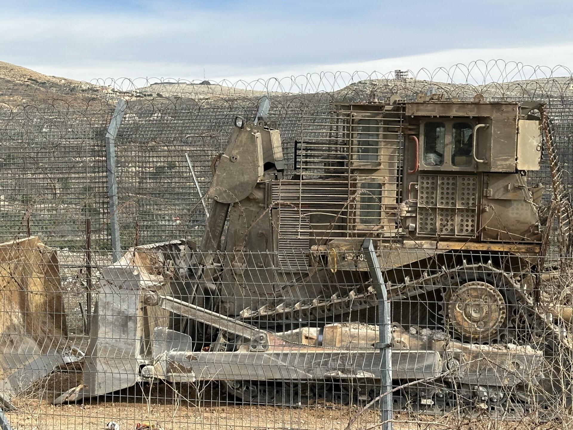 Israeli army bulldozer on the 1974 ceasefire line between Israel and Syria.