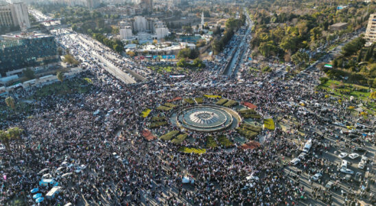 thousands of people march in Damascus to celebrate the victory