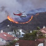 In Los Angeles an upscale neighborhood surrounded by the flames