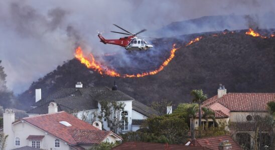 In Los Angeles an upscale neighborhood surrounded by the flames