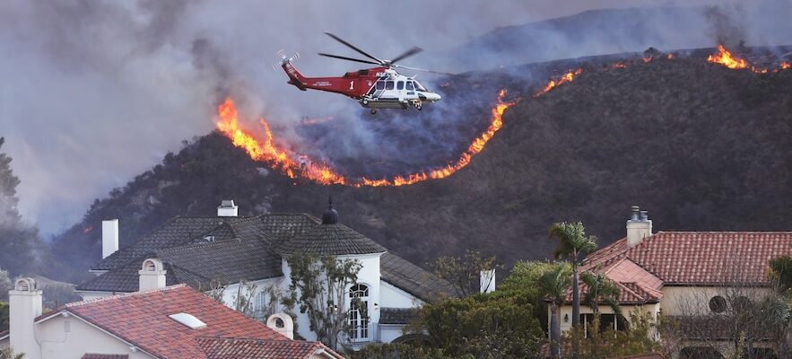 In Los Angeles an upscale neighborhood surrounded by the flames