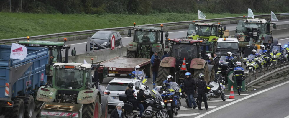 tractors surrounded by the police en route to Paris