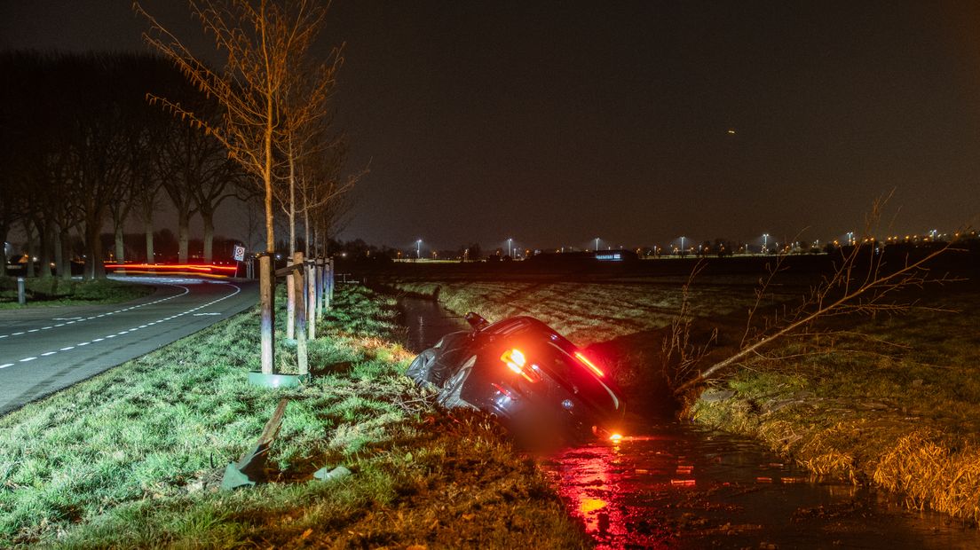 Car on the water on the Blindeweg in Montfoort.