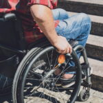 In Clermont Ferrand a policeman strikes a man in a wheelchair