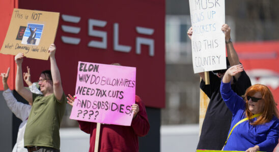 In the United States anti musk demonstrators gather in front of