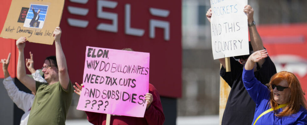 In the United States anti musk demonstrators gather in front of